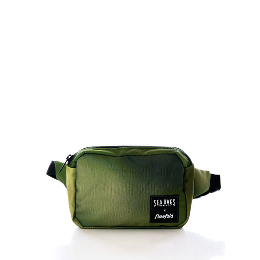 A rectangular olive green Dragon Skin Belt Bag from Sea Bags, sustainably crafted and showcasing a Sea Bags x Flowfold logo patch, is displayed against a plain white background—blending rugged style with eco-friendly design. by Sea Bags