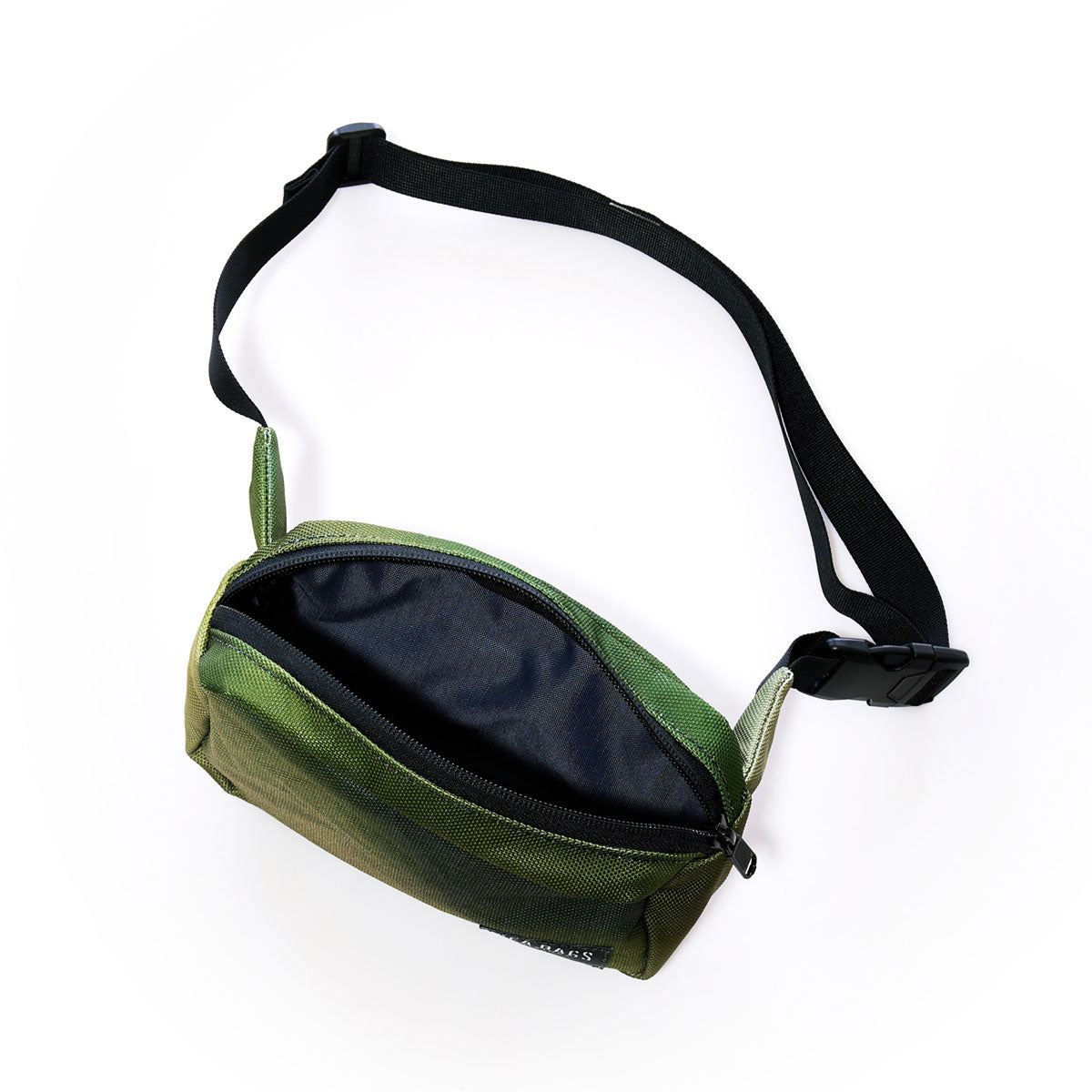 The Sea Bags Dragon Skin Belt Bag features green fabric adorned with a black adjustable strap and buckle. Shown unzipped to display its black interior lining, this sustainably crafted accessory is photographed against a white background. by Sea Bags