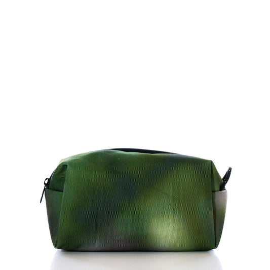 The Dragon Skin Toiletry Bag by Sea Bags, a rectangular green sustainable toiletry bag featuring a zipper, is displayed on a white background and photographed from the front. by Sea Bags