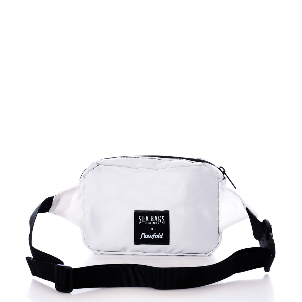 A sustainable belt bag in the Navy Anchor design, crafted from recycled sail cloth by Sea Bags, featuring a black adjustable strap and a front label reading Sea Bags, photographed on a white background. by Sea Bags