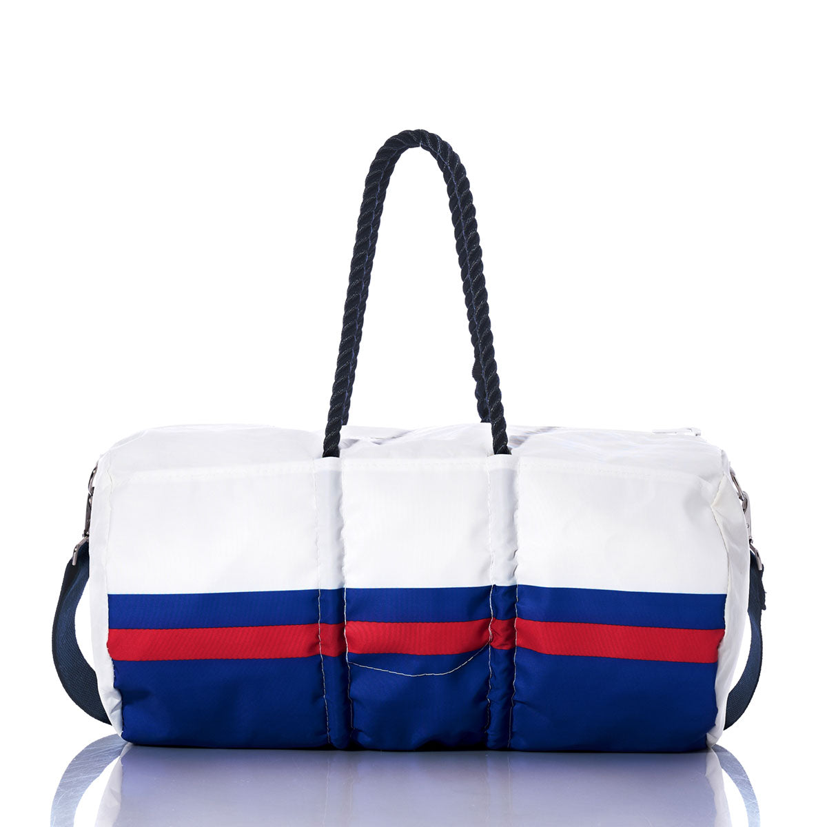 The Sea Bags Buffalo Bills Duffel features eco-friendly construction from recycled sail cloth in white, accented with blue and red horizontal stripes, navy rope handles, and a detachable shoulder strap. Displayed on a reflective surface, this unique duffel bag is the perfect sporty game day accessory for Buffalo Bills fans. by Sea Bags
