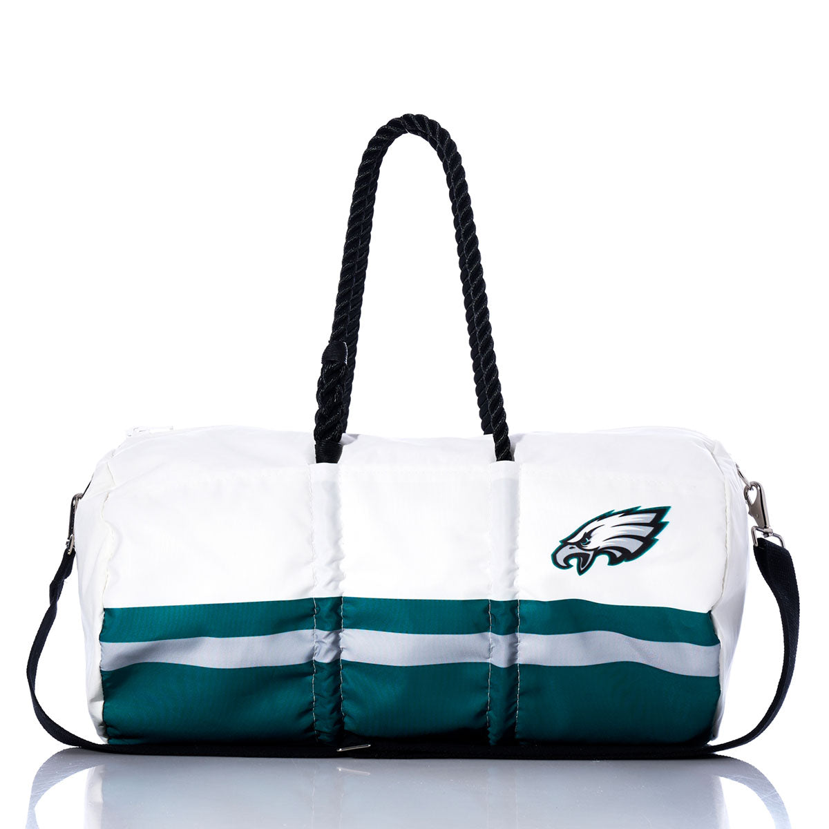 The Sea Bags Philadelphia Eagles Duffel is a white and green bag crafted from recycled sail cloth, featuring black handles, a detachable black shoulder strap, and a prominent Philadelphia Eagles logo on the front. by Sea Bags
