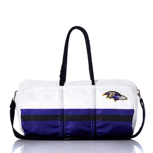 Sea Bags Baltimore Ravens Duffel featuring a white and purple design, black rope handles, black shoulder strap, and the Baltimore Ravens logo on one side. by Sea Bags