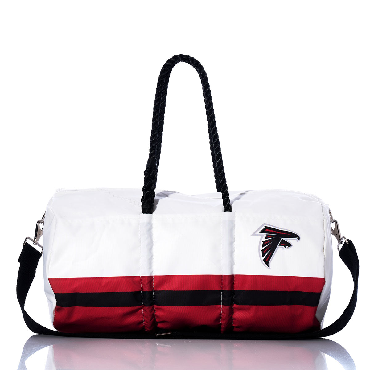 The Atlanta Falcons Duffel by Sea Bags is crafted from recycled sail cloth in white and red, featuring black handles, a shoulder strap, and an NFL logo on the side. It’s shown against a white background. by Sea Bags