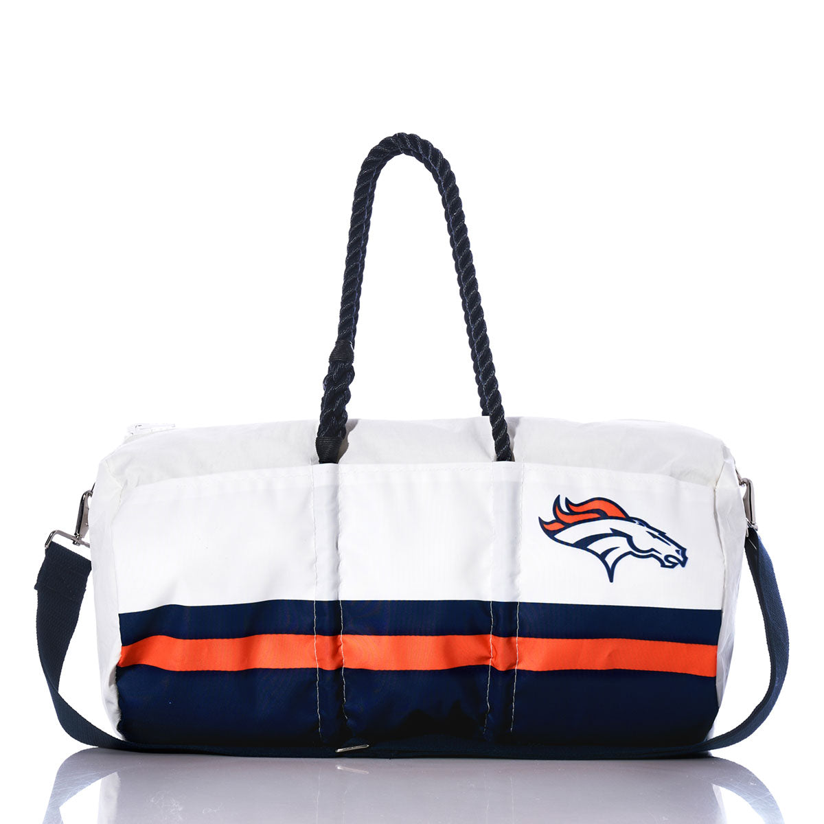 A Denver Broncos Duffel by Sea Bags, made from recycled sail cloth in white, navy, and orange with rope handles and a shoulder strap, is displayed centered against a white background. by Sea Bags