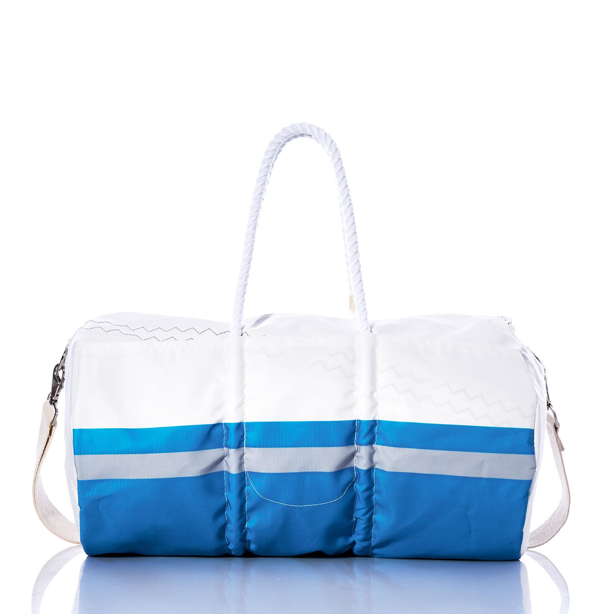The Sea Bags Detroit Lions Duffel, featuring white and blue sail cloth with rope handles and a detachable shoulder strap, is displayed on a reflective surface against a white background. by Sea Bags