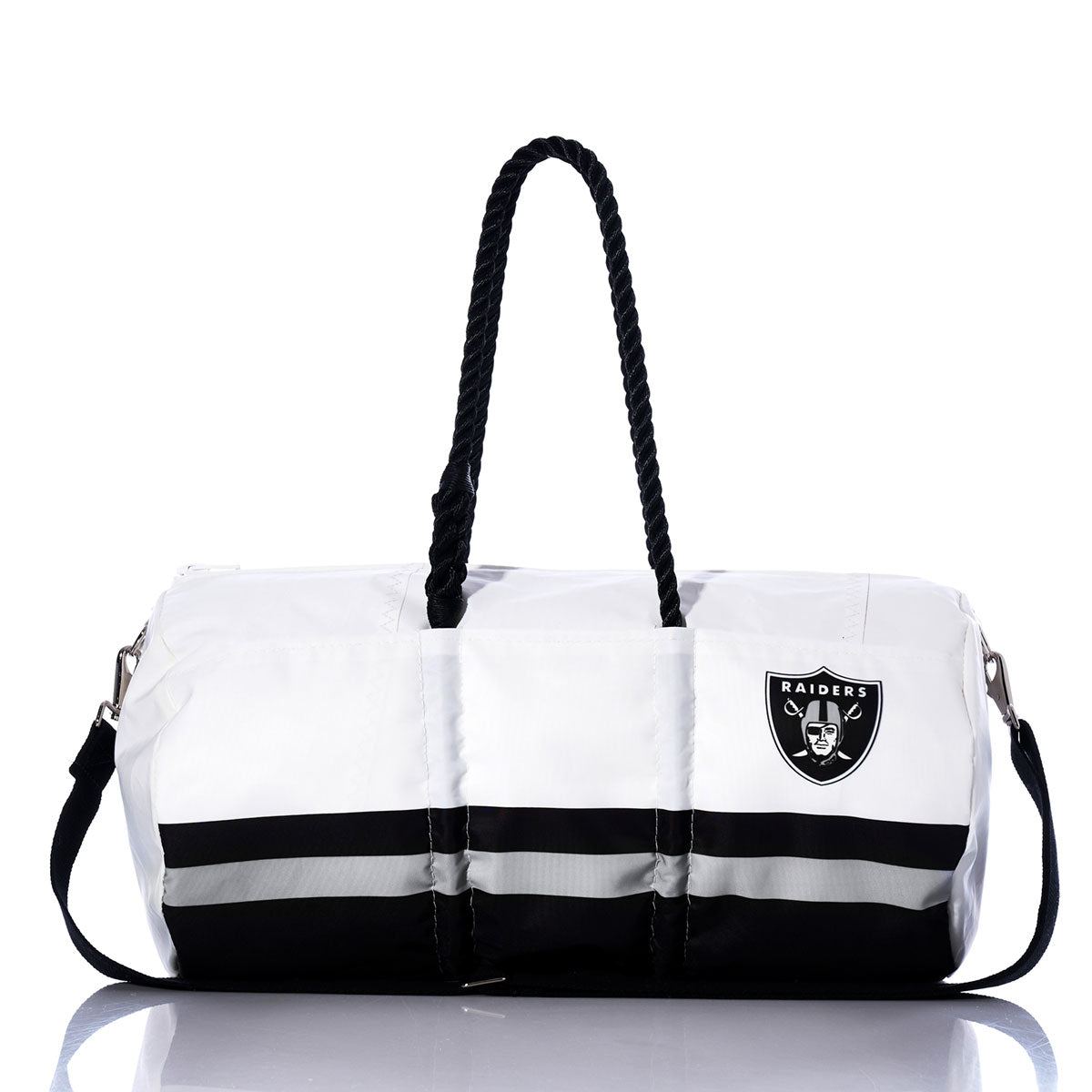 Show off your team spirit with the Las Vegas Raiders Duffel by Sea Bags—a white and black bag featuring sturdy black handles, a convenient shoulder strap, and the iconic Raiders logo on one side. Made from durable materials, this versatile Sea Bags duffel is ideal for travel or game days and perfect for any Las Vegas Raiders fan. by Sea Bags