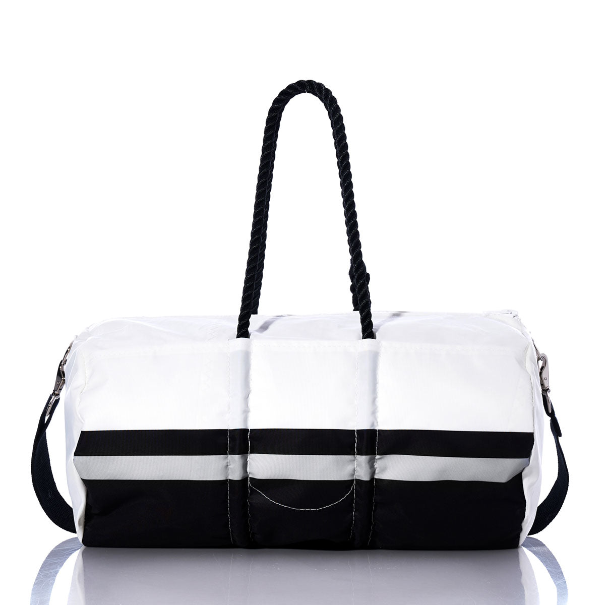 A Las Vegas Raiders Duffel by Sea Bags, made from recycled sail cloth, features a two-tone design with a white upper, black base, black side strap, and two black twisted handles, displayed on a reflective surface. by Sea Bags