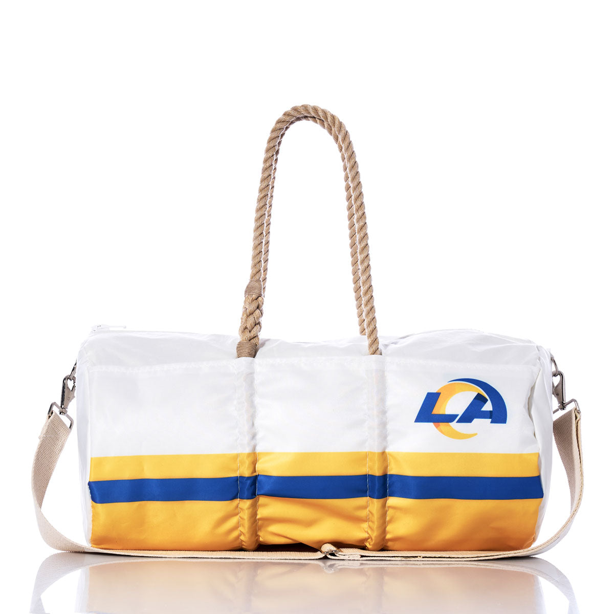 The Los Angeles Rams Duffel by Sea Bags, crafted from recycled sail cloth, features yellow and blue stripes, rope handles, a beige shoulder strap, and the Rams logo on the side. The bag is displayed on a reflective surface. by Sea Bags