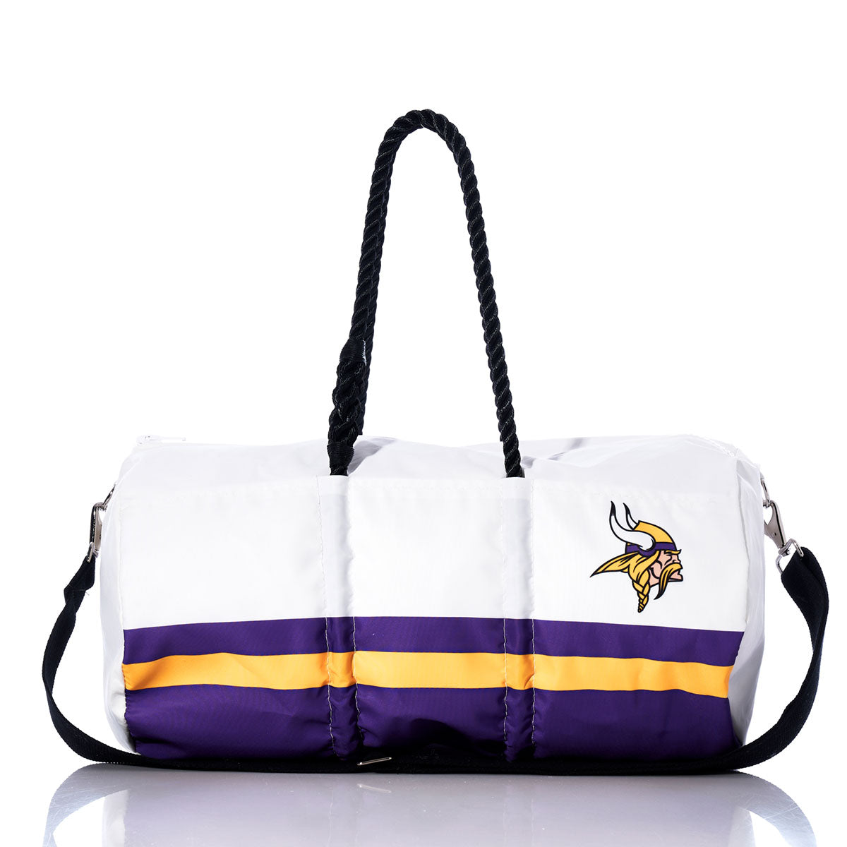 The Sea Bags Minnesota Vikings Duffel features black rope handles, purple and yellow stripes, and a Viking head logo on the front. Crafted from recycled sail cloth, this white duffel bag is displayed on a white background—a unique accessory for NFL fans. by Sea Bags