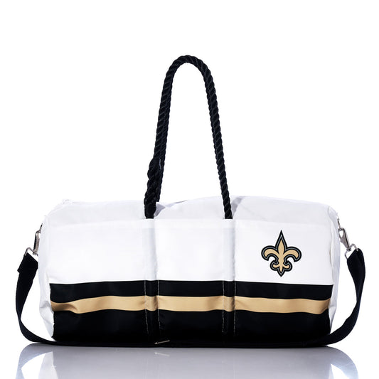 The Sea Bags New Orleans Saints Duffel is crafted from recycled sail cloth and showcases white and black colors with gold and black stripes, plus a fleur-de-lis logo on one side. It features sturdy black rope handles and a detachable black shoulder strap, making it the perfect bag for Saints fans on the go. by Sea Bags