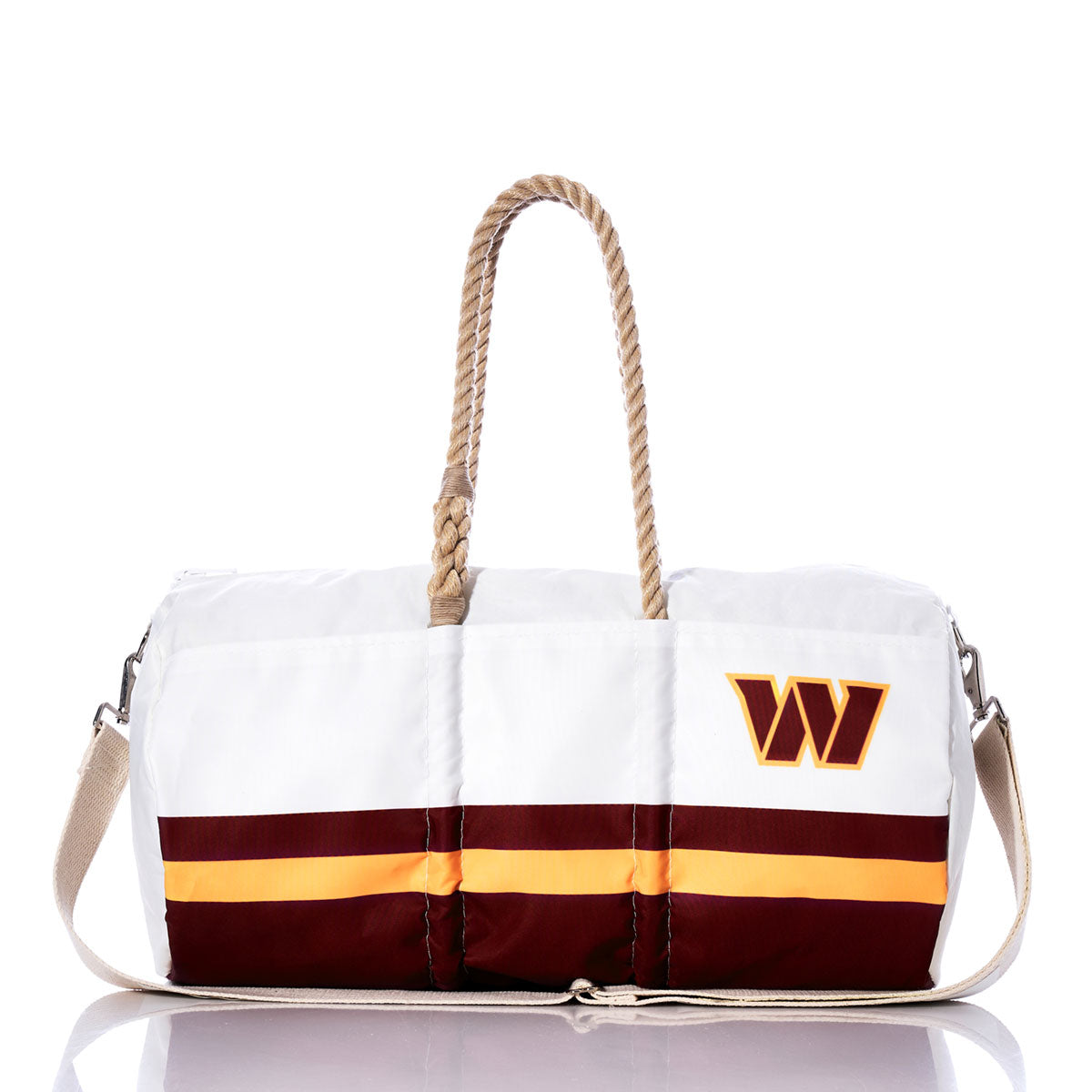 The Sea Bags Washington Commanders Duffel is crafted from recycled sail cloth and features a white exterior with maroon and yellow stripes, rope handles, a beige shoulder strap, and a W logo on one side. The bag is shown against a white background. by Sea Bags