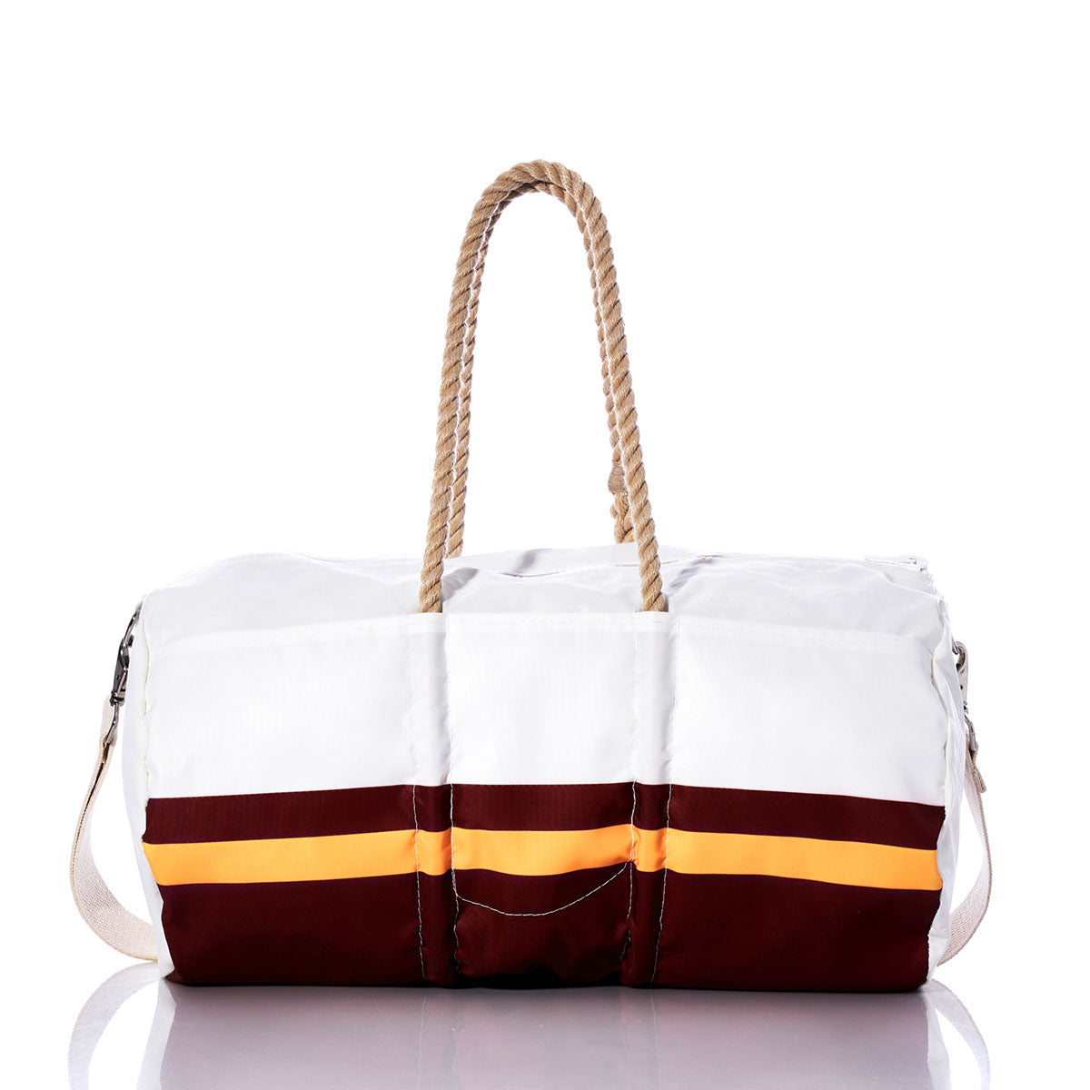 The Sea Bags Washington Commanders Duffel, crafted from recycled sail cloth, showcases white and maroon panels with an orange stripe, complemented by rope handles and a cream-colored shoulder strap. It is displayed on a reflective surface. by Sea Bags