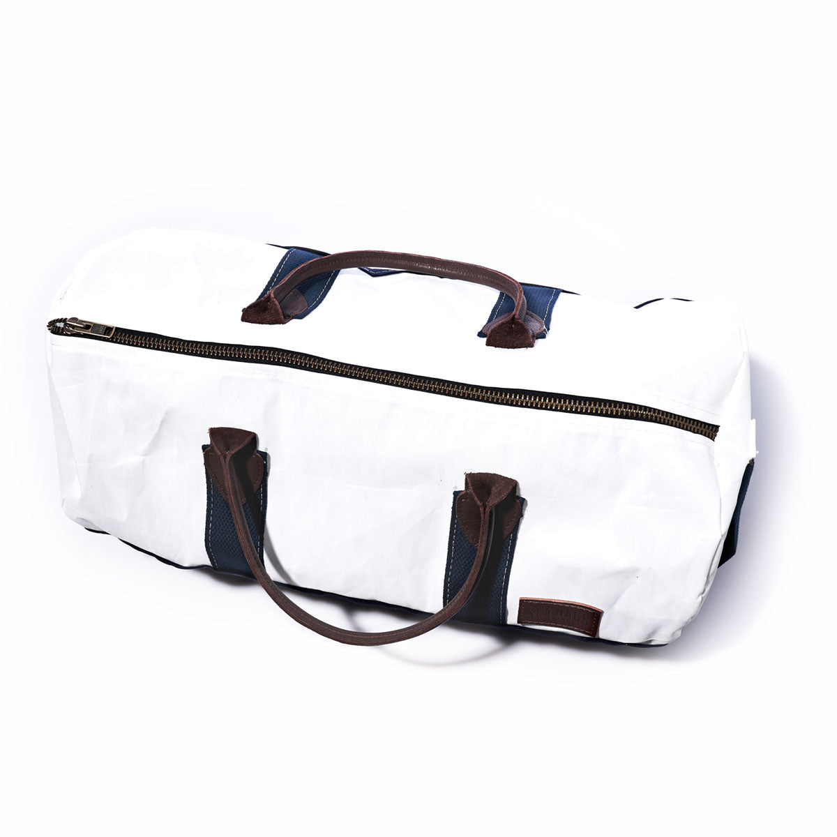 A Sea Bags Custom Chebeague Duffel featuring dark brown handles, a zipper closure, and blue accents is displayed on a plain white background. by Sea Bags