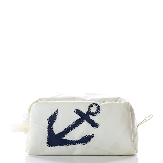 The Navy Anchor Toiletry Bag by Sea Bags is crafted from recycled sail bags, featuring a white fabric exterior with a dark blue anchor on the front and a classic zippered closure. The pouch is photographed against a white background. by Sea Bags