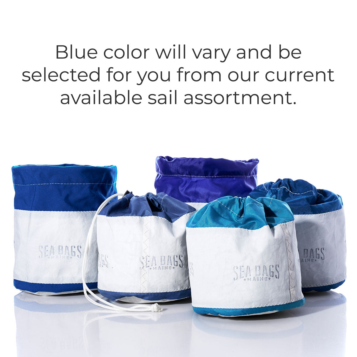 Five Sea Bags Ditty Bags, crafted from recycled sail cloth in white and blue, are displayed against a white background. Please note that the shade of blue will vary and will be chosen from available options—making these bags ideal for stylish organization. by Sea Bags