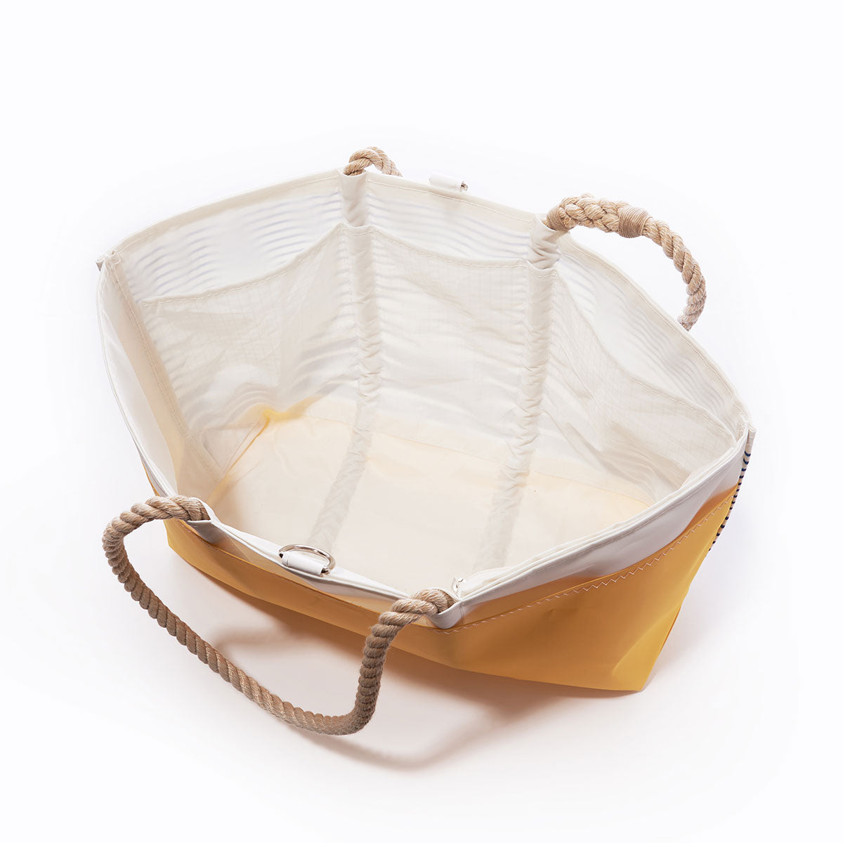 Open Blue Stripe Ogunquit Beach Tote by Sea Bags with rope handles, crafted from recycled sail cloth, photographed from above on a white background. by Sea Bags