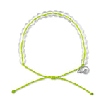 The 4ocean Beaded Bracelet - Sea Turtle by 4ocean features clear beads, a small silver charm, and an adjustable neon green string, all arranged in a circle on a white background—this sustainable bracelet is designed to support ocean conservation efforts. by Sea Bags
