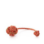 A Floating Rope Dog Toy - Orange by Fetch ME, handmade in Maine, features an orange and green rope tied into a knotted ball on one end and a smaller knot on the other, displayed against a white background. by Sea Bags