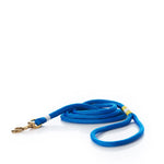 A coiled Maine Rope Dog Leash - Blue by Custom Cordage / DBA Maine Rope Mats, featuring yacht braid rope and a brass clasp, is handmade in Maine and displayed on a white background. by Sea Bags