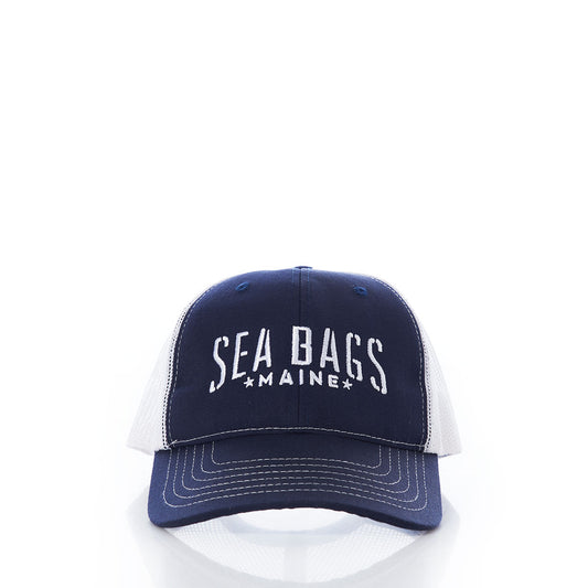 Navy blue and white Sea Bags Trucker Hat by 320Ink d/b/a Riptide Print Company, featuring SEA BAGS MAINE text on the front and displayed on a plain white background. This adjustable Trucker cap provides comfortable sun protection, making it ideal for outdoor activities. by Sea Bags