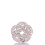 A natural-colored rope, intricately tied into a circular nautical sailor knot with a detailed pattern, is displayed on a white reflective surface against a plain white background, reminiscent of Nautical Sailor Knot Coasters-Natural.