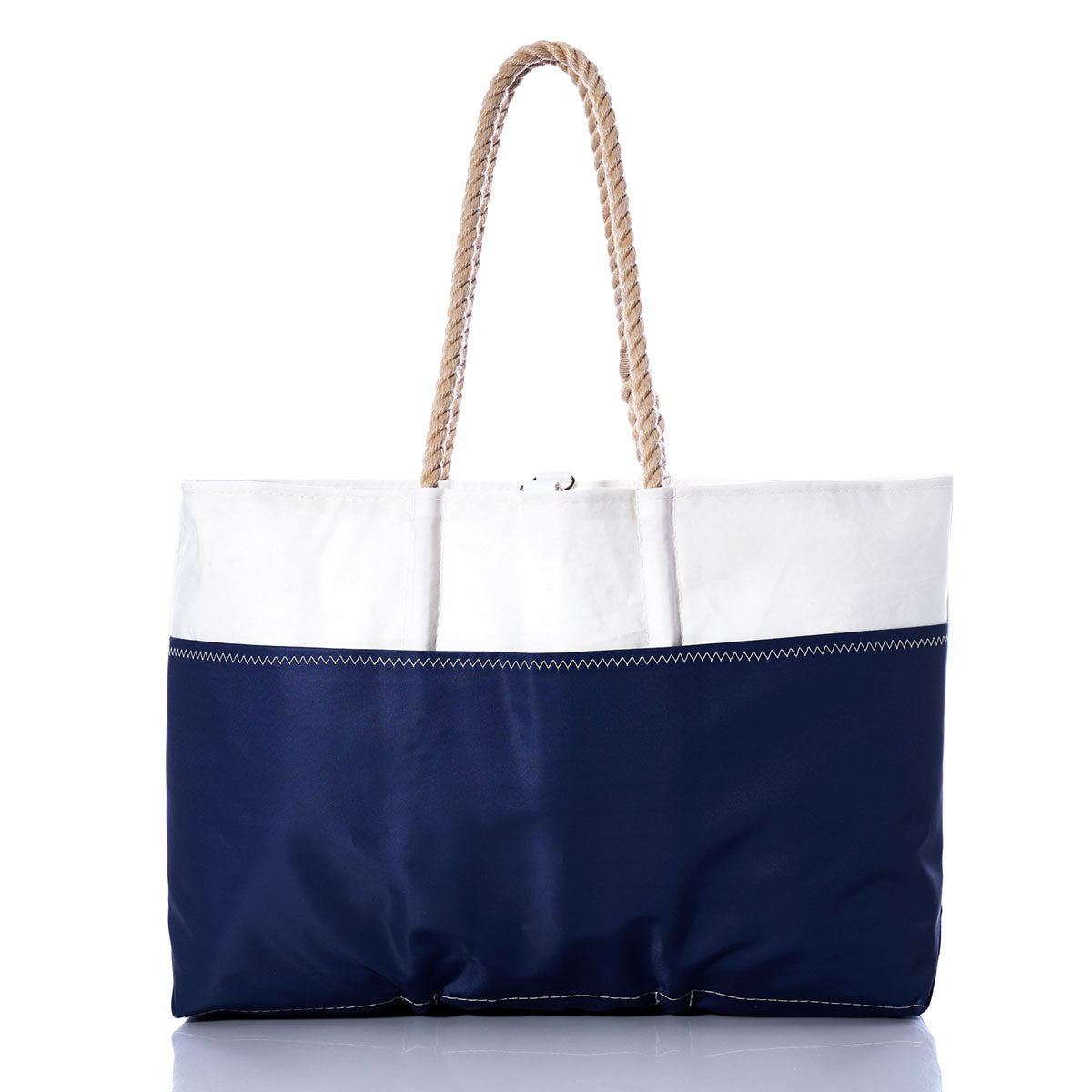 The Sea Bags Custom Design Ogunquit Beach Tote is a large beach bag made from reclaimed sail cloth, featuring white and navy blue panels, rope handles, and visible zigzag stitching. It is shown against a white background. by Sea Bags