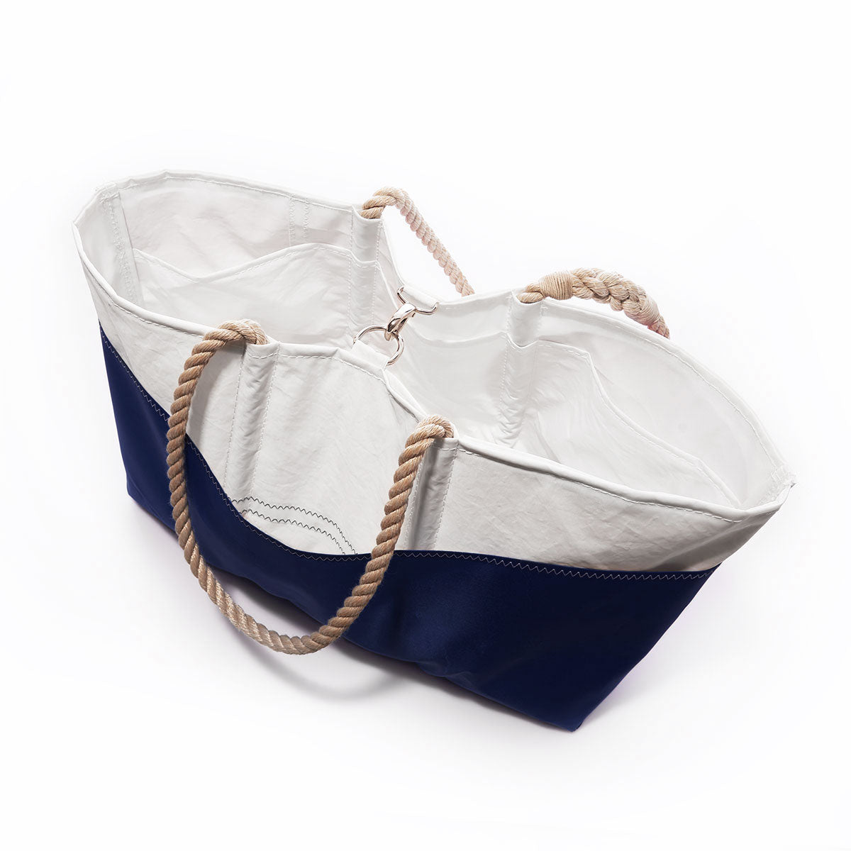 Sea Bags Custom Design Ogunquit Beach Tote features a white upper section, navy blue bottom, and tan rope handles, displayed on a white background. Crafted from reclaimed sailcloth, this versatile bag can be personalized and is perfect as a tote for your next seaside adventure. by Sea Bags